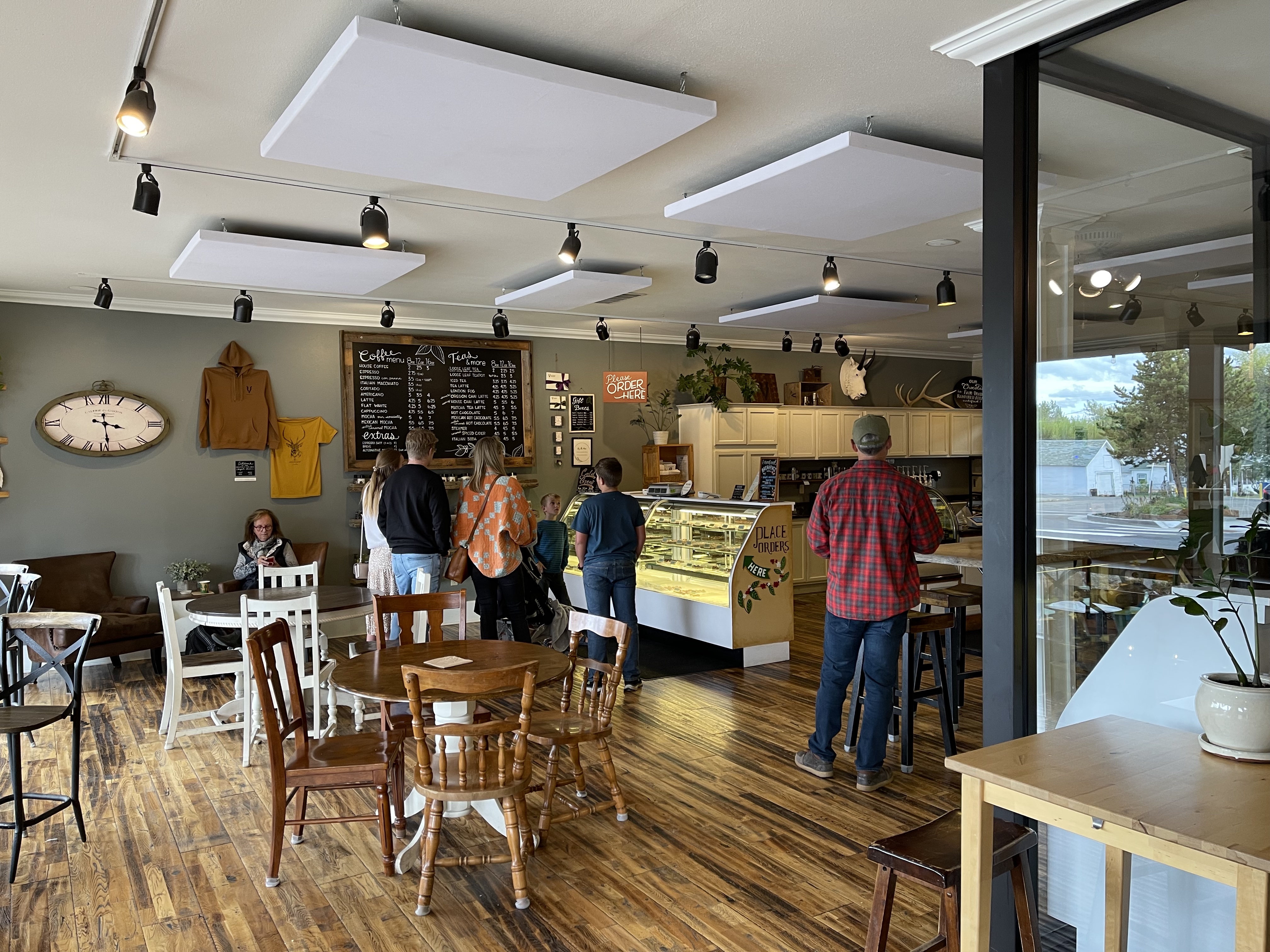 Interior of chocolate shop, round tables with space around them