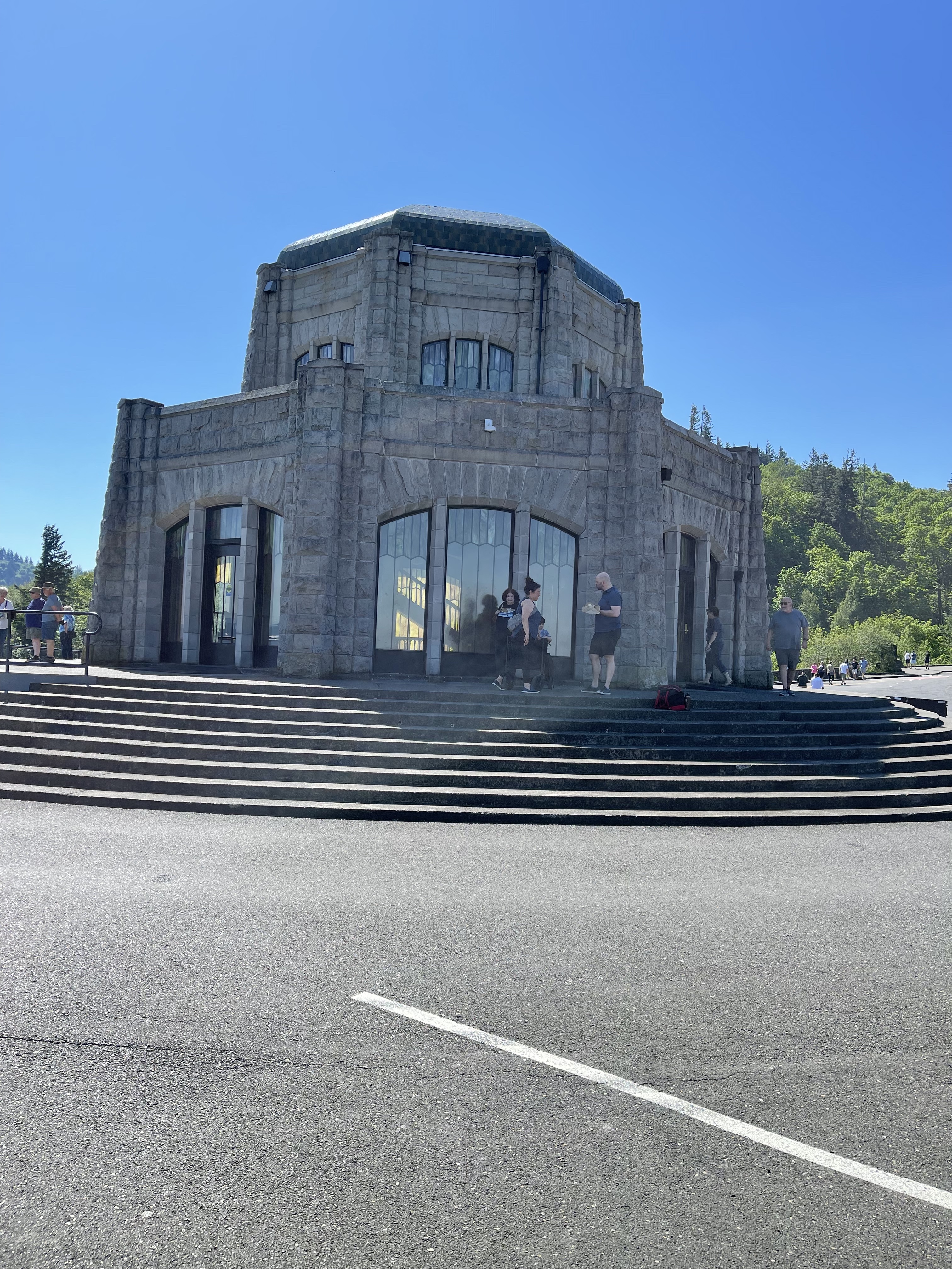 Octagonal stone building set on a pedestal of concrete