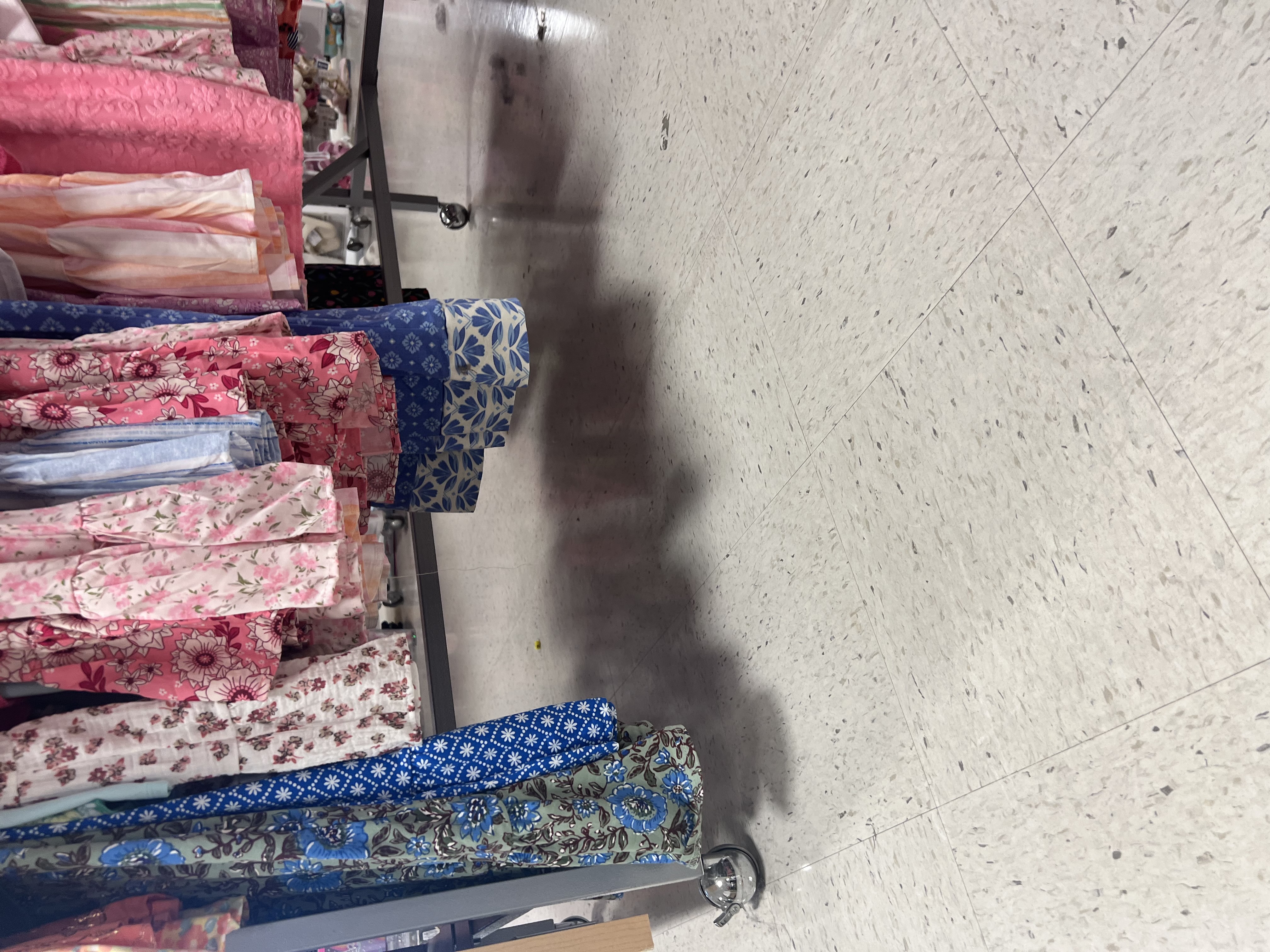 View from below the clothing racks, showing the gap that could be missed from a cane.