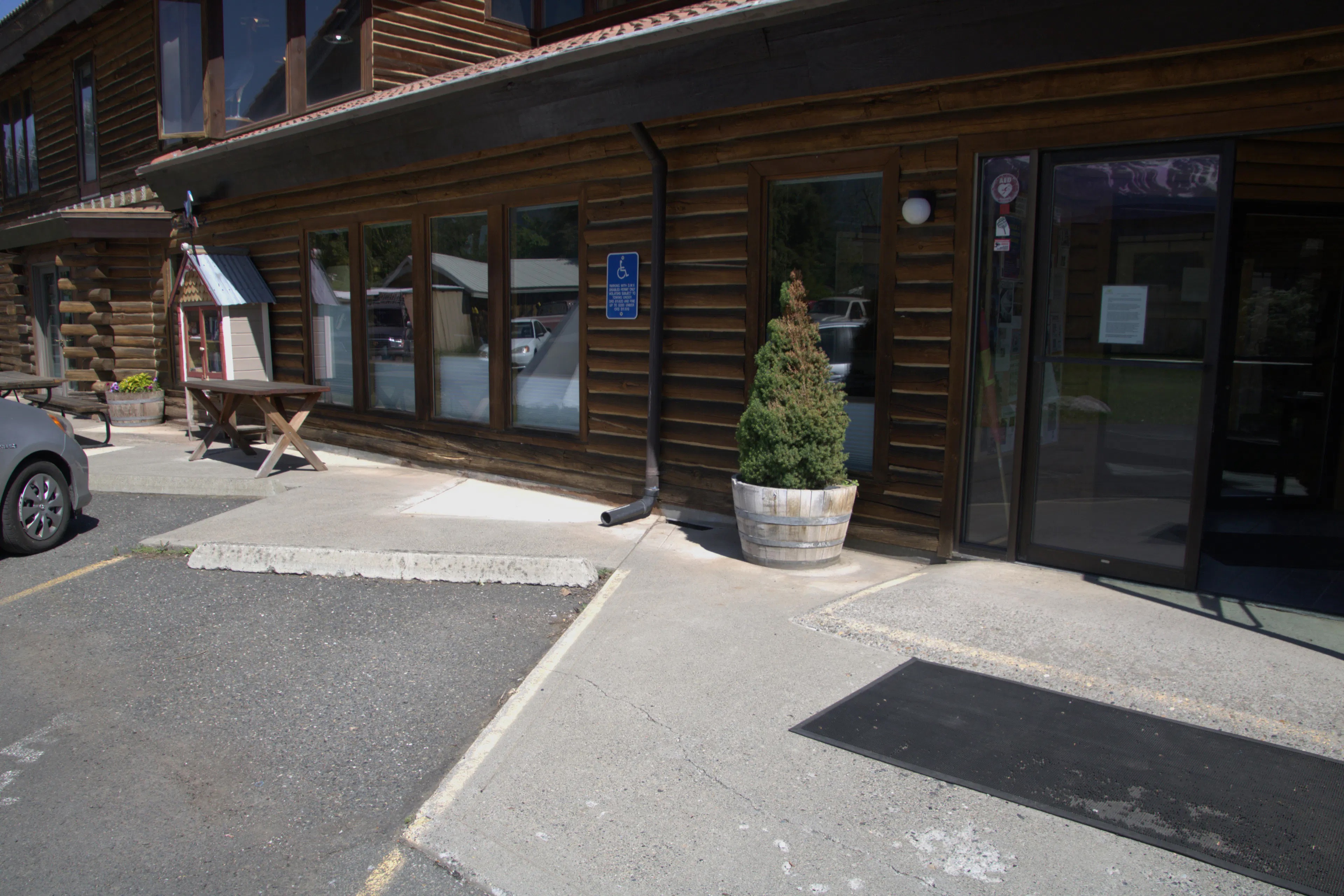 Photo shows accessible parking space near the doors