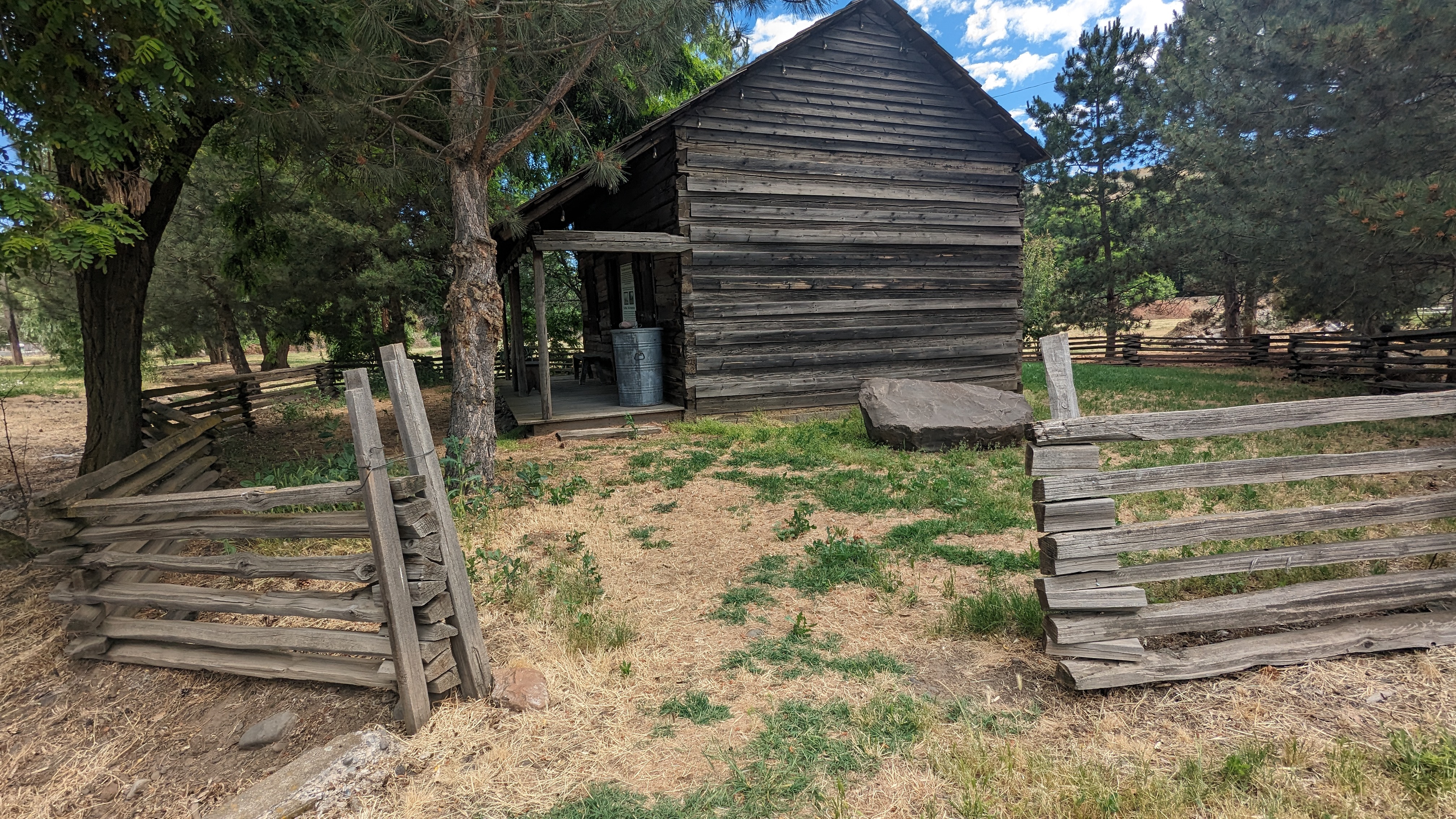 Entrance to back cabin has 2 steps and the path to is lumpy grass, gravel and a degraded wood bridge.