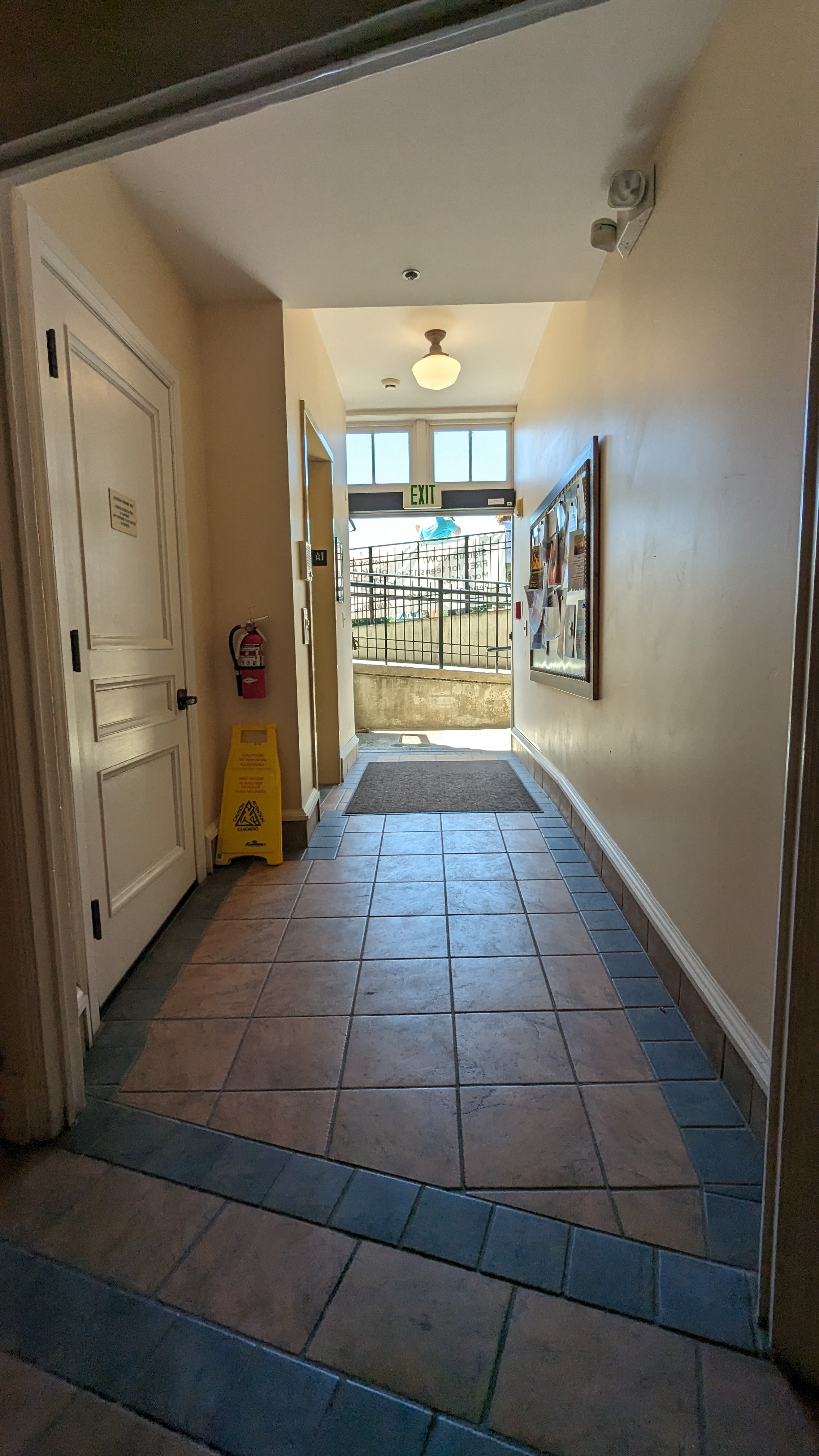 ADA entrance/exit, hallway to elevator on the left facing outside.