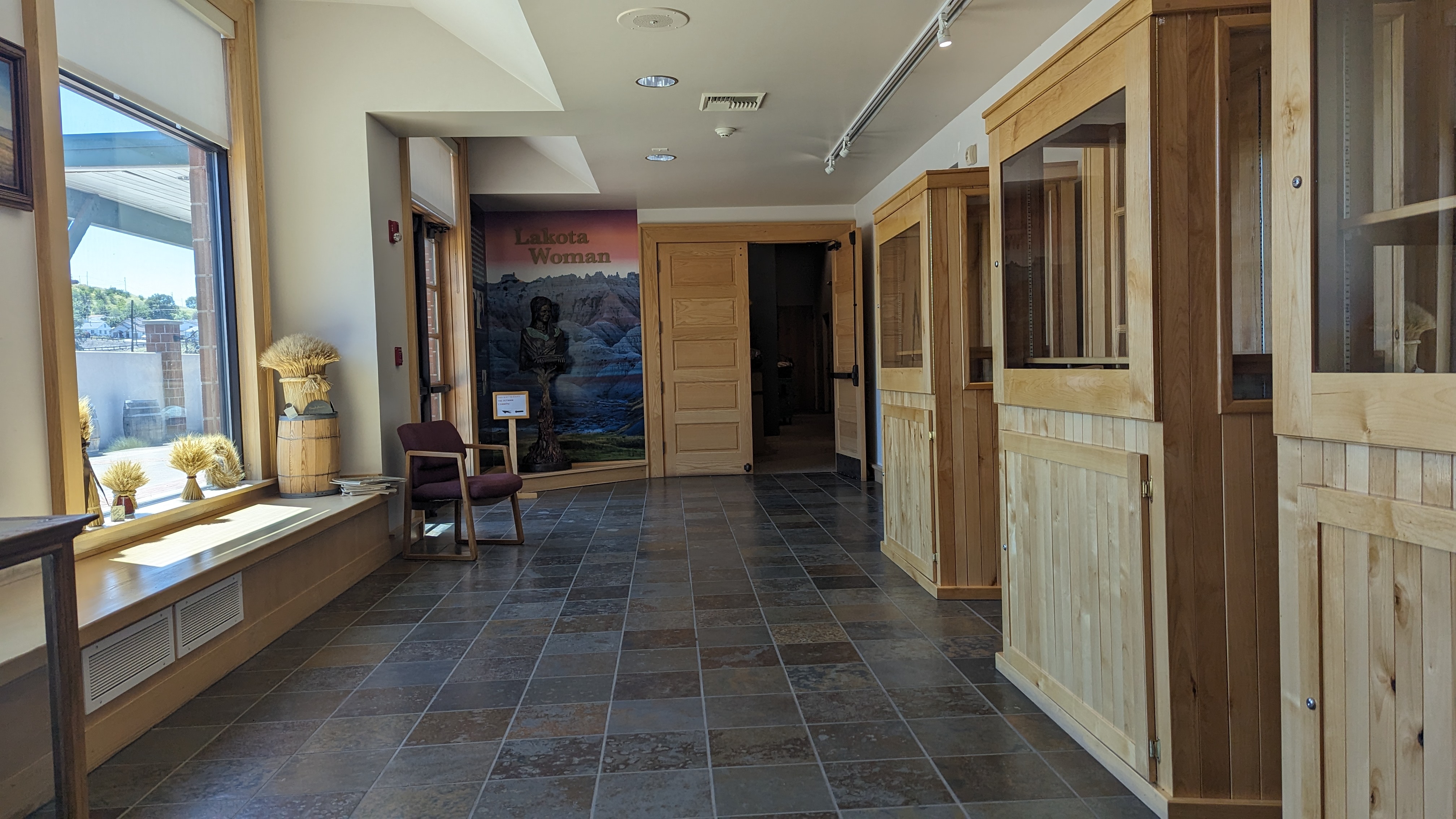 Hallway to restroom and outdoor exhibits.