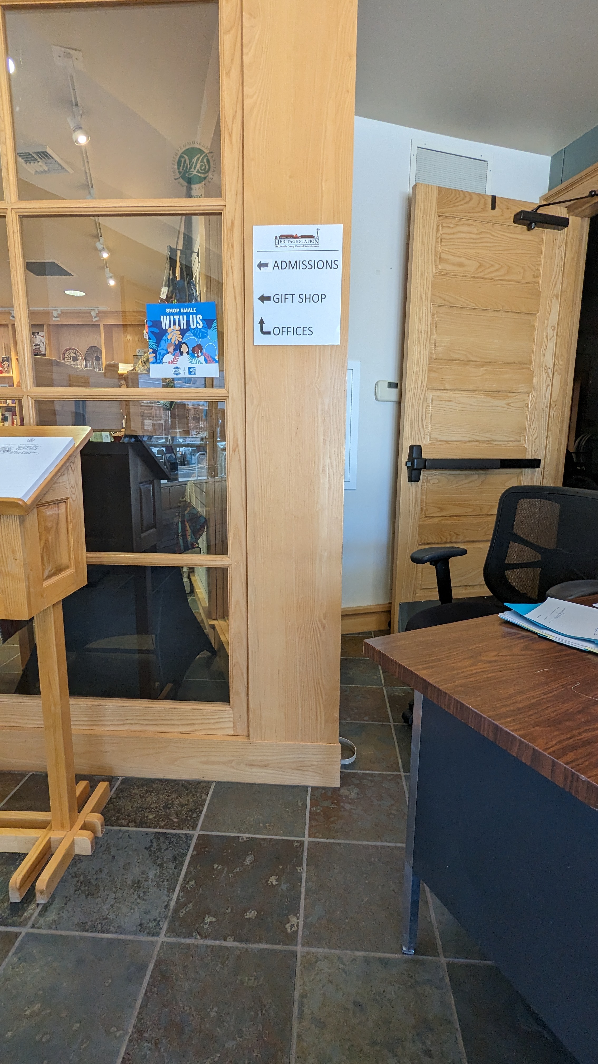 Signage at front desk right inside the doors.