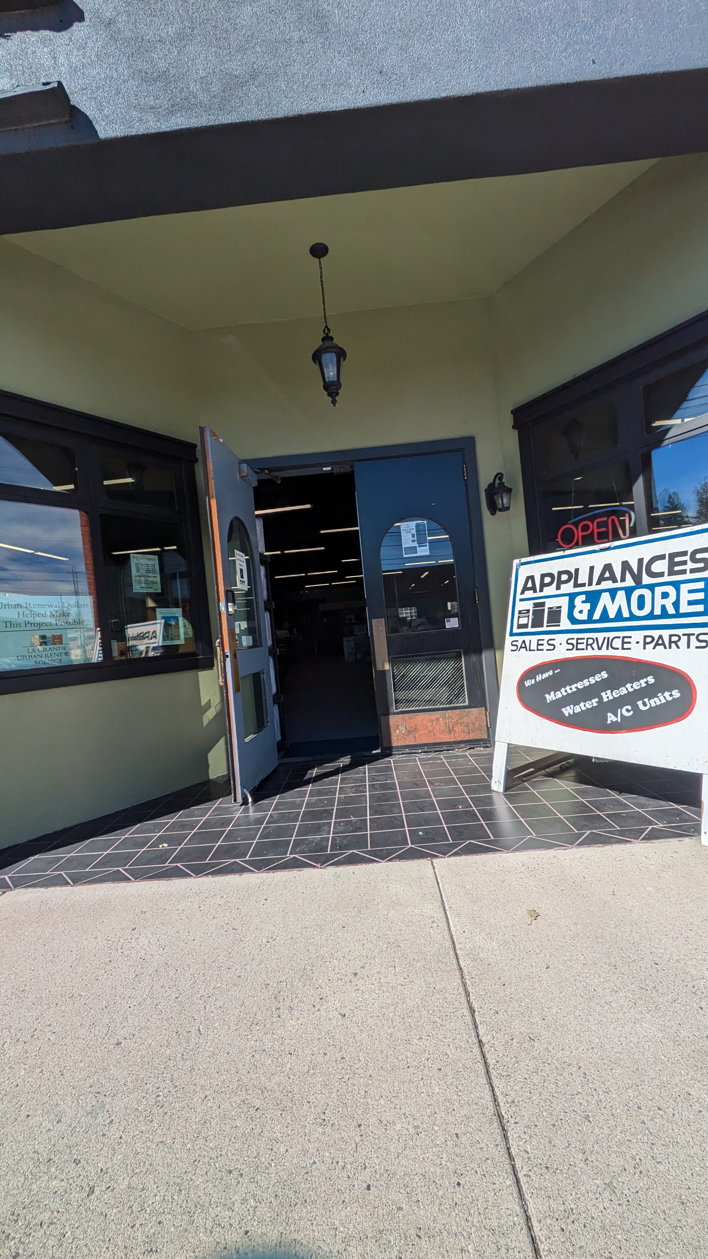 Smooth paved entrance with double doors.