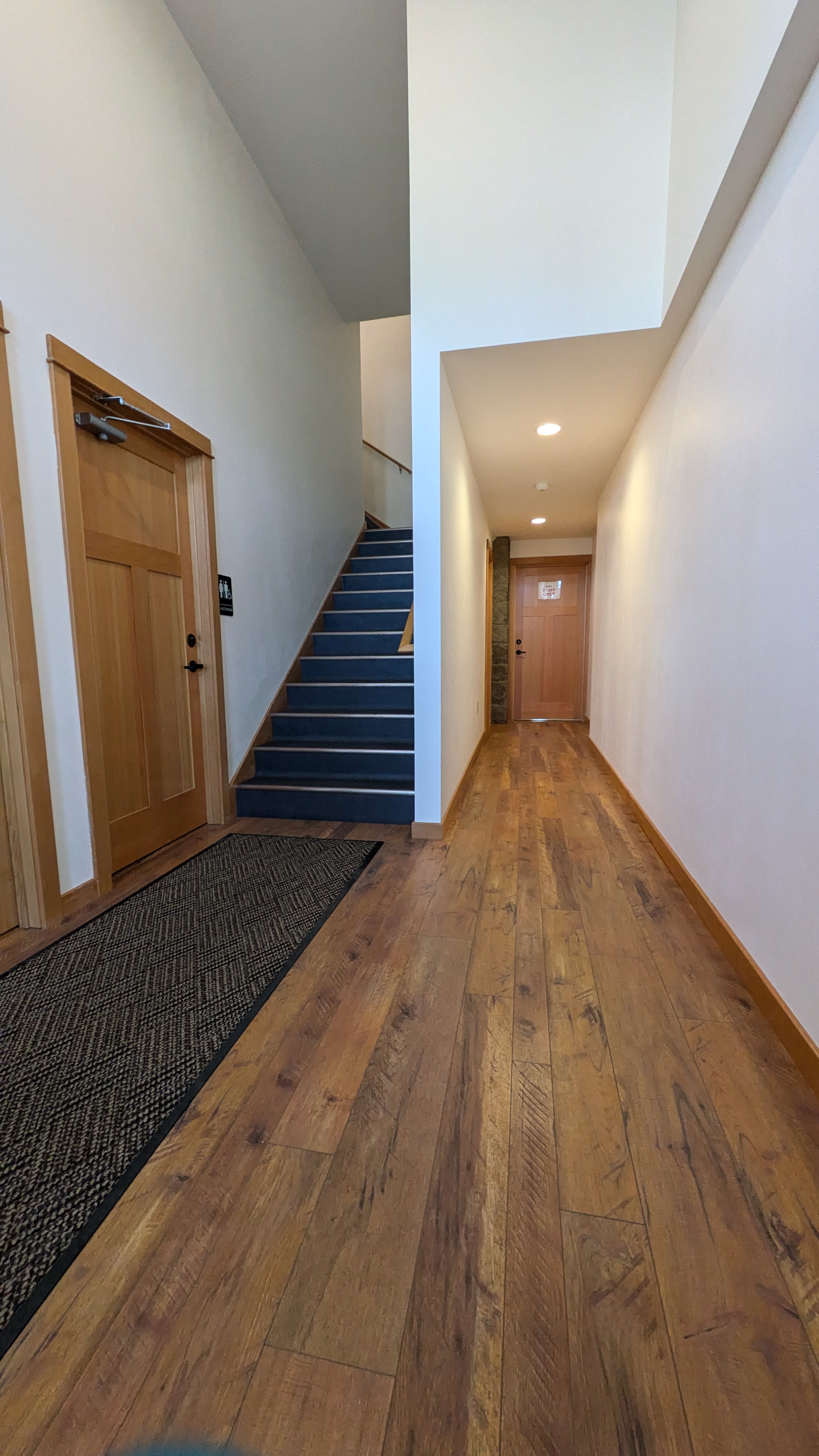 Hallway where restrooms are located, through the kitchen.
