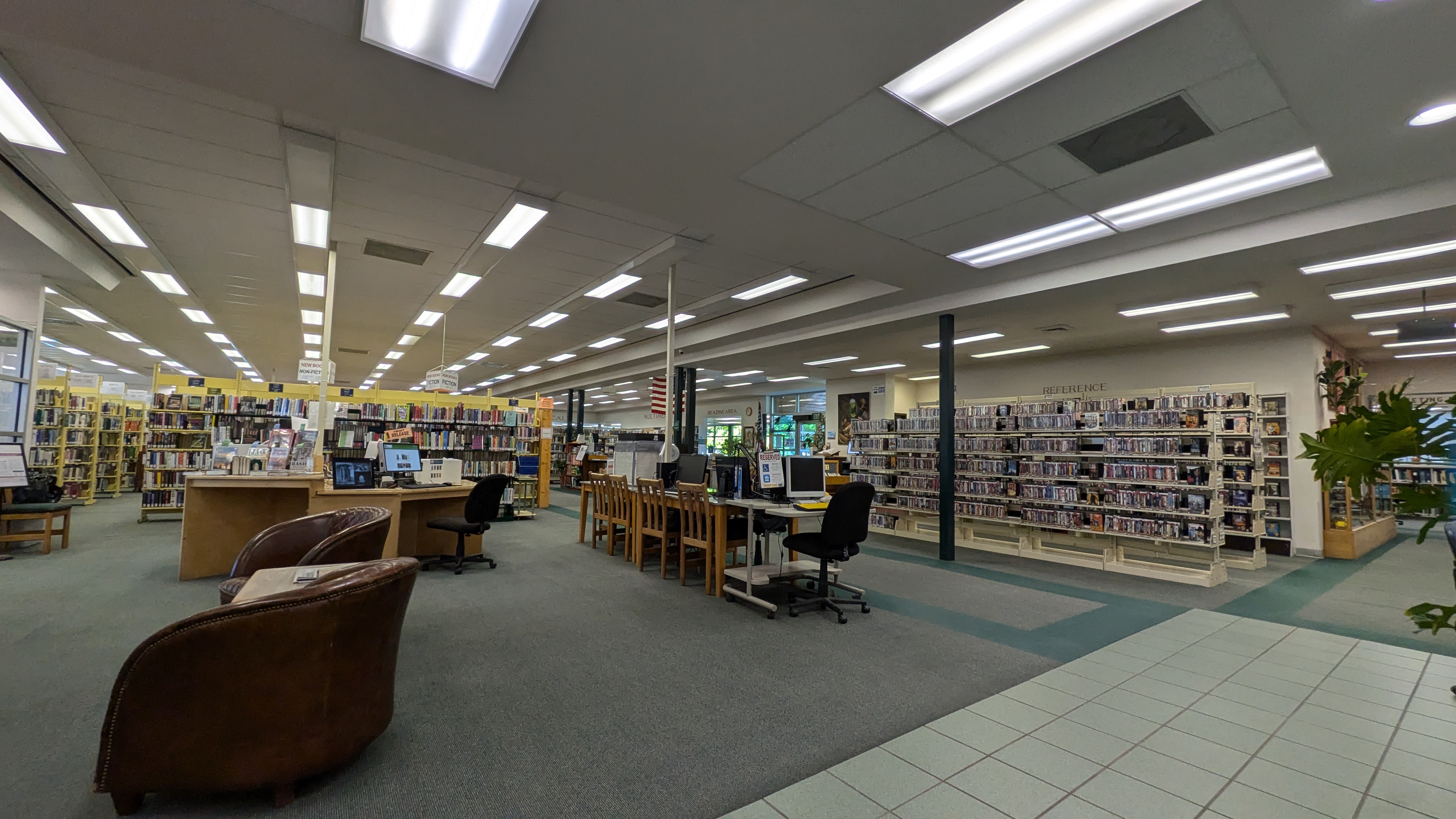 inside to the left of front desk