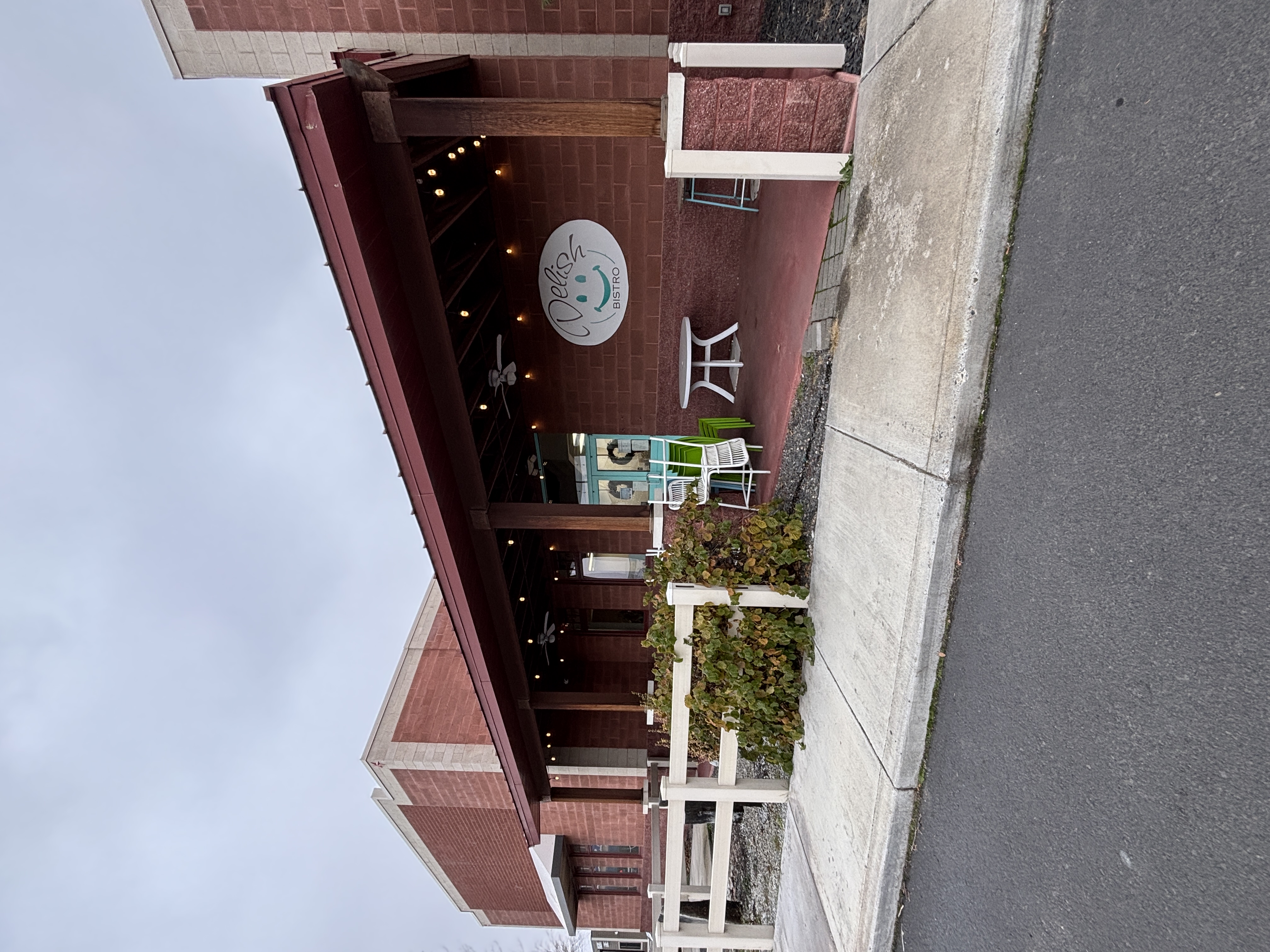 Outdoor seating available depending on season. Setup of chairs and tables varies. Door can be opened with closed fist and enters towards the ordering desk.