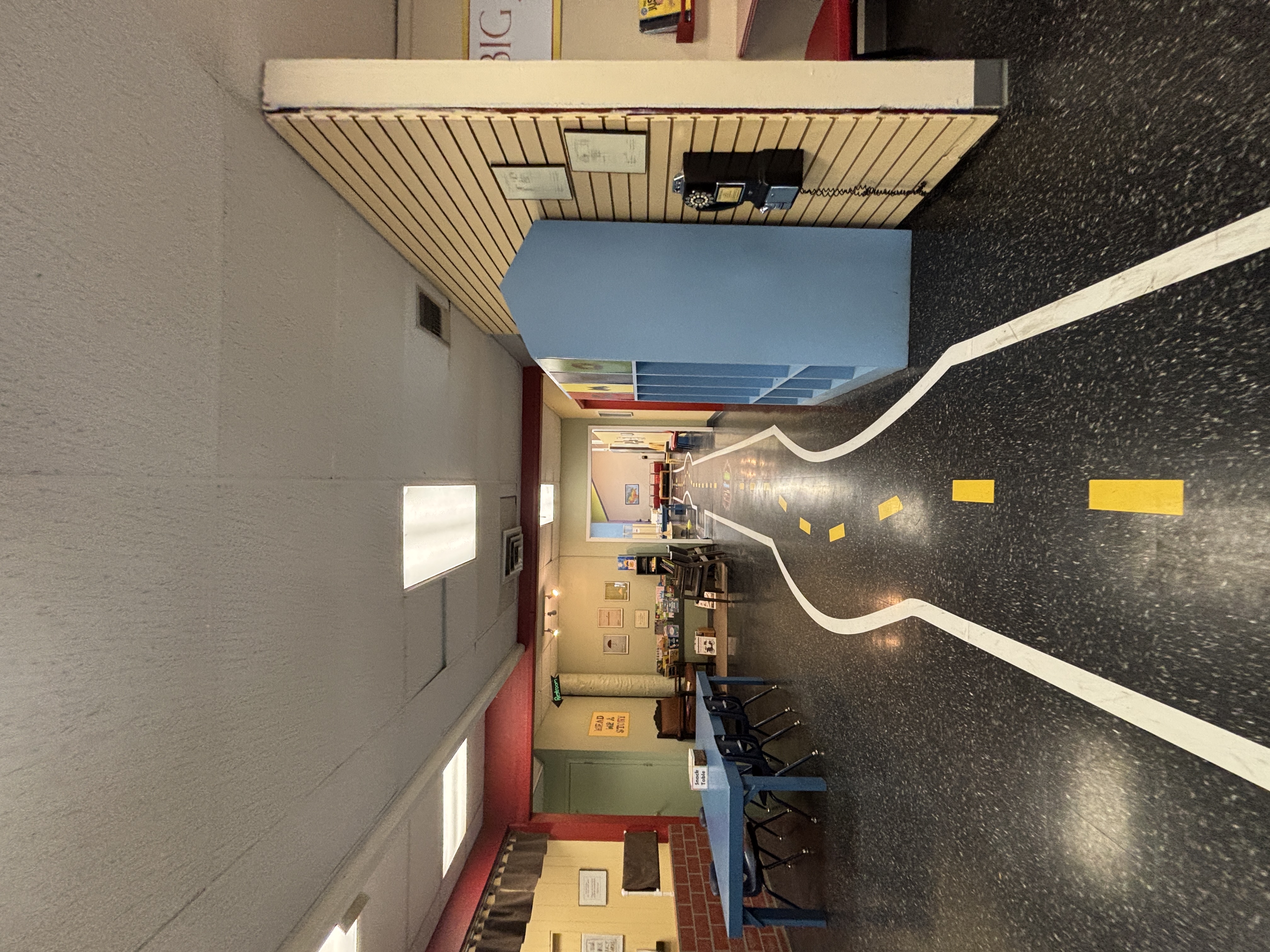 Wide hallway leading you to pockets of different activities.