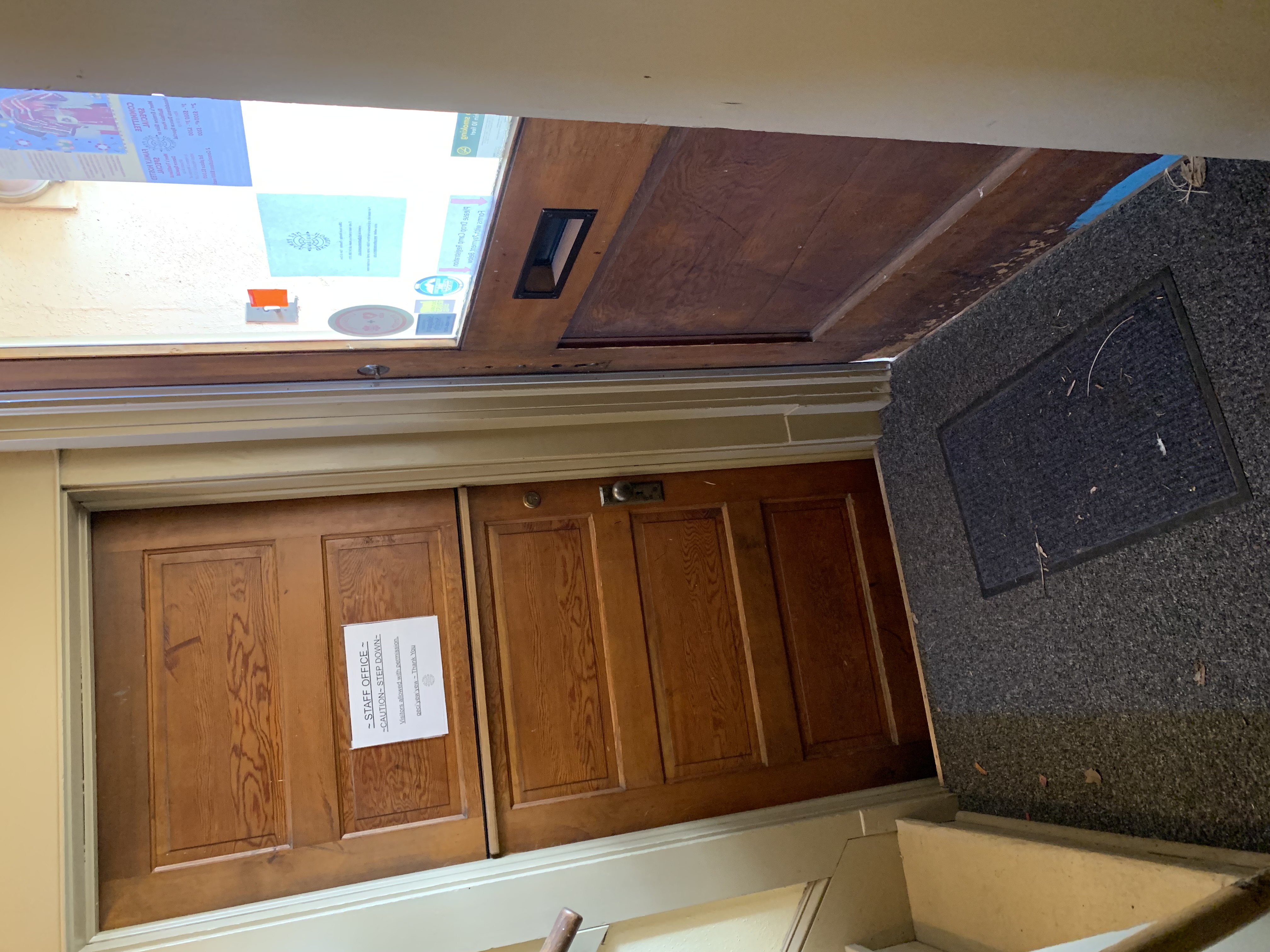 Getting to the restroom requires traveling through the entryway. Coming from the visitor center (as shown in this photo) or the exterior both require a step up into the entryway, then a step down into the office.