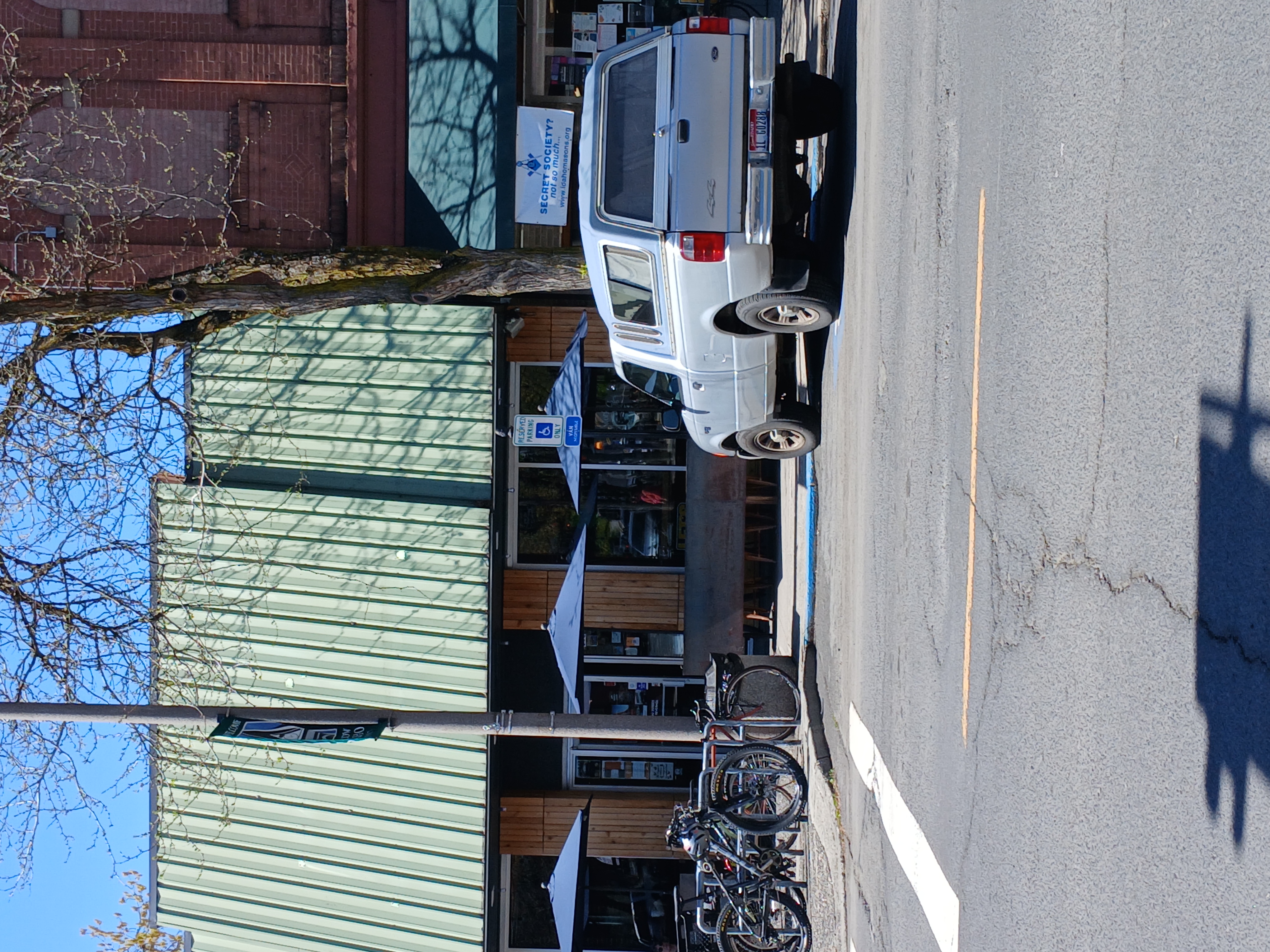 This is the accessible parking space that's within the block. It's located down towards One World Cafe. There is no curb cut at this parking space; you have to go to the crosswalk curb cut to get onto the sidewalk.