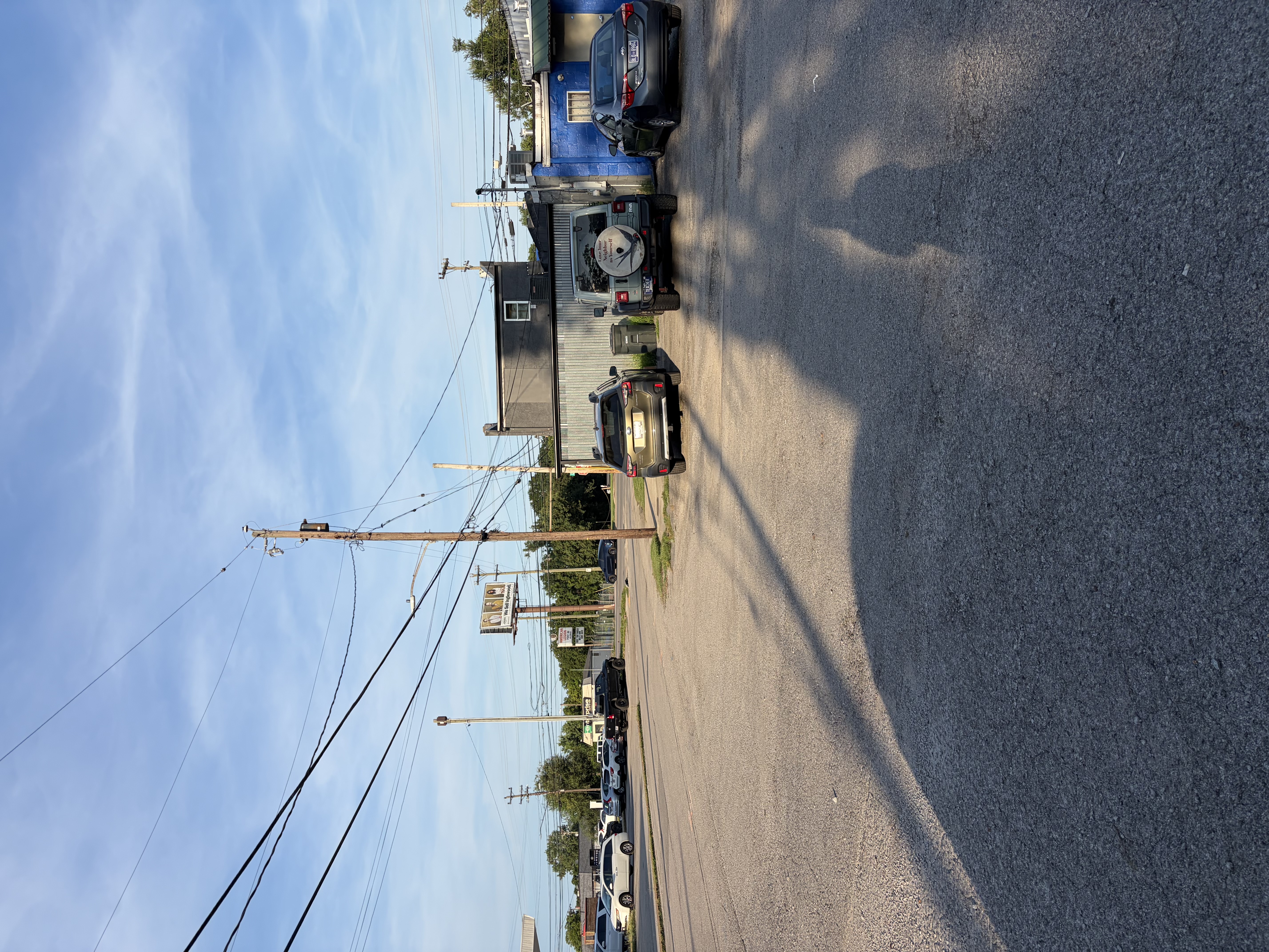 Rear of the building and part of the lot. Spaces are unmarked